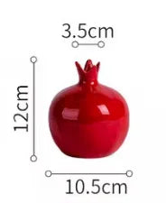 Red pomegranate with measurements in centimeters