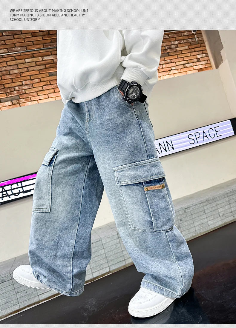 Person wearing light blue cargo pants with a white shirt and white sneakers in an indoor setting.