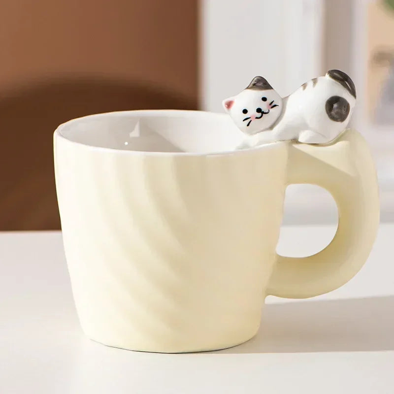 White ceramic mug with a cat-shaped object on a neutral background