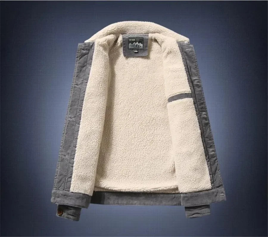 Two-tone jacket with beige fleece interior and gray exterior on a dark blue background