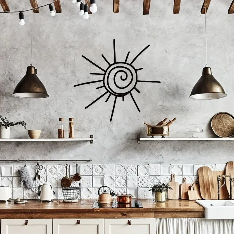 Modern kitchen with a sun-shaped wall art piece on a concrete wall.