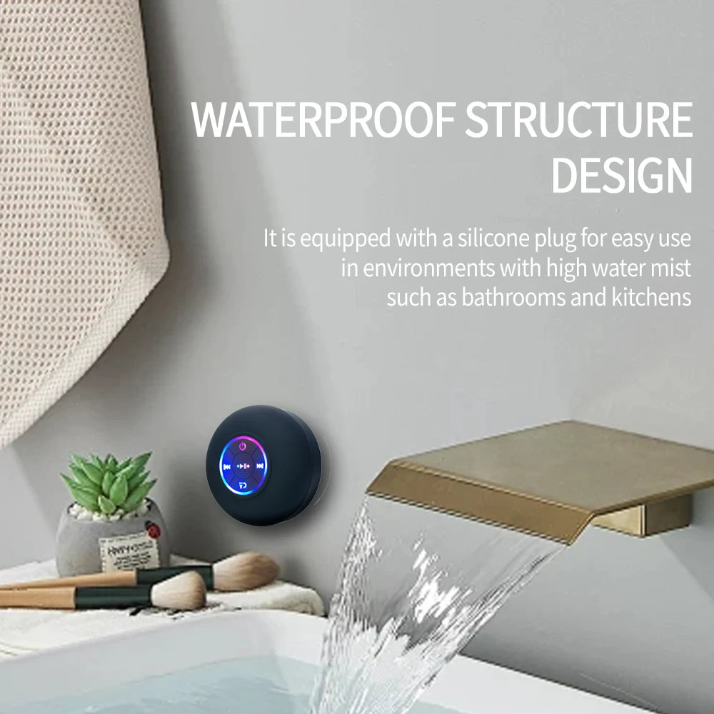 round waterproof bluetooth shower speaker with LED light ring attached to bathroom wall using suction cup