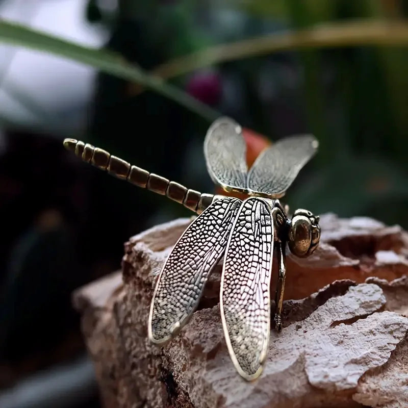 vintage brass dragonfly figurine desk ornament DArtano home decor on a rock outside