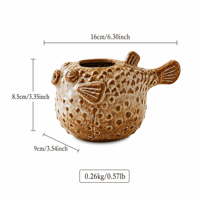A brown puffer fish shaped planter with dimension lines showing its width, height, and depth, along with its weight, on a white background.