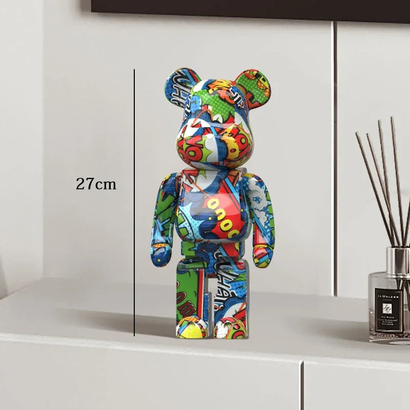 Colorful bear-shaped figure on a white surface with a diffuser in the background