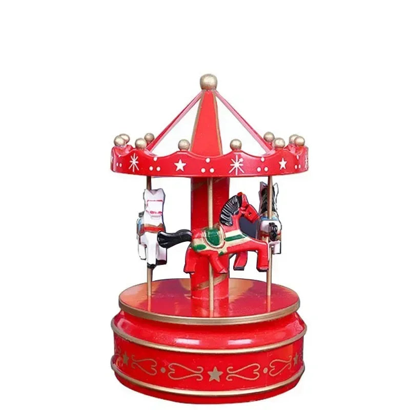 Red carousel toy with horses on a white background