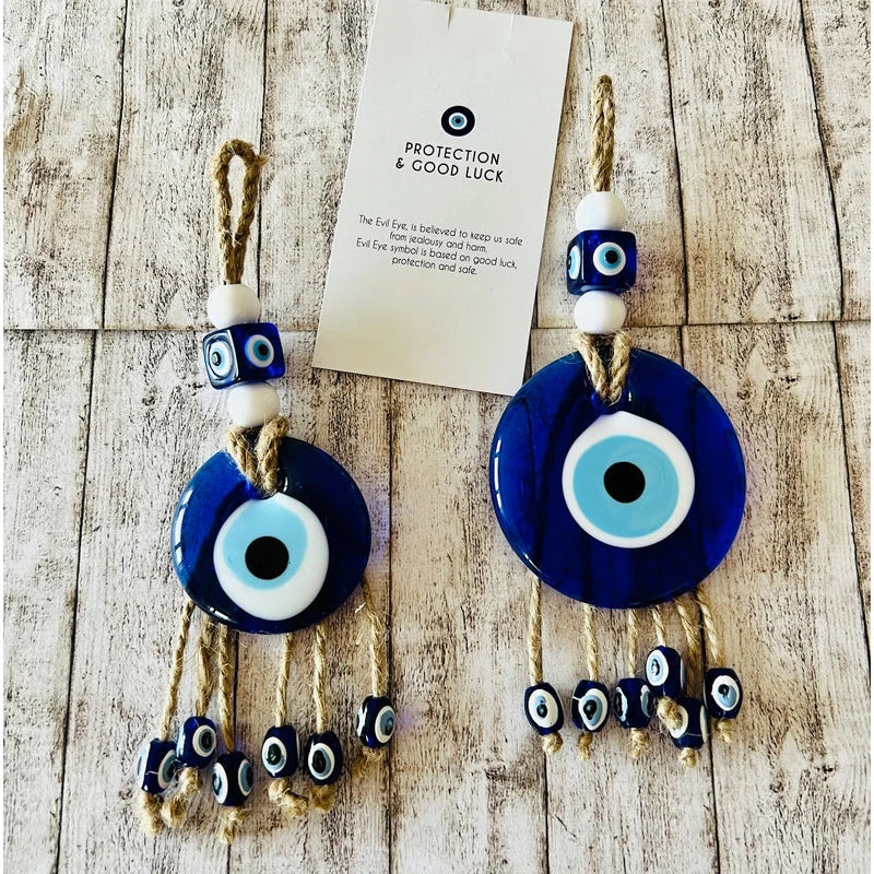Evil eye decorations with beads on a wooden surface