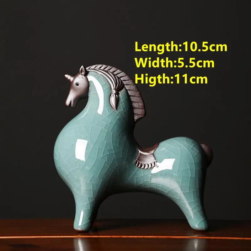 Teal ceramic horse figurine with measurements on a dark background