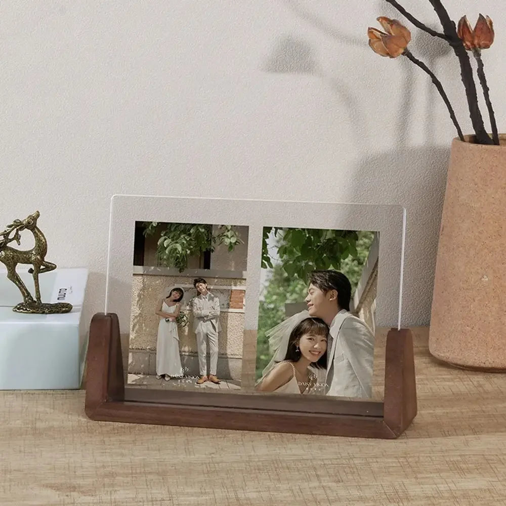 Tabletop photo frame with a couple's wedding photo on a wooden surface.