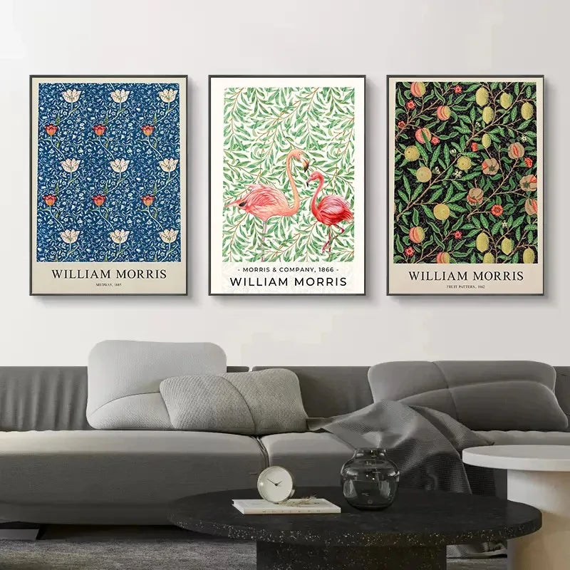 Three framed William Morris artworks on a wall above a sofa.