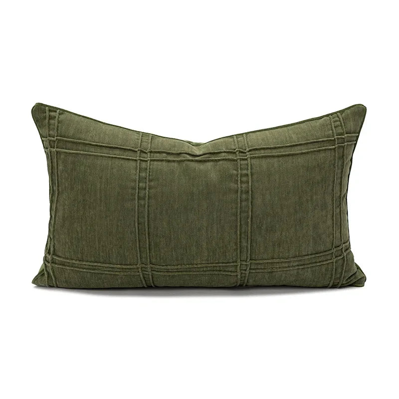 Green pillow with pleated texture on a white background