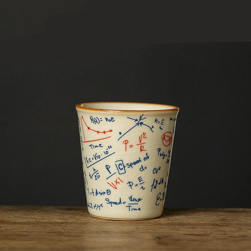 Ceramic cup with scientific equations on a dark background
