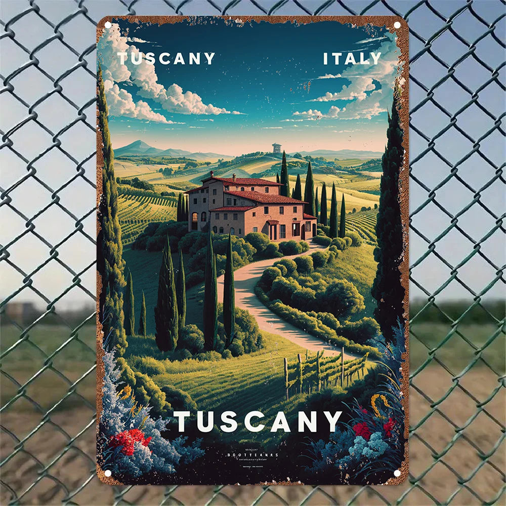 Vintage-style metal sign of Tuscany, Italy, featuring a villa and rolling hills, displayed on a chain-link fence.