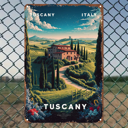 Vintage-style metal sign of Tuscany, Italy, featuring a villa and rolling hills, displayed on a chain-link fence.