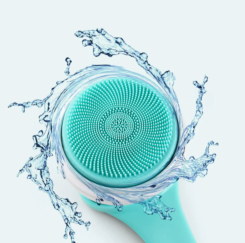 Turquoise facial cleansing brush with water splashes on a light blue background
