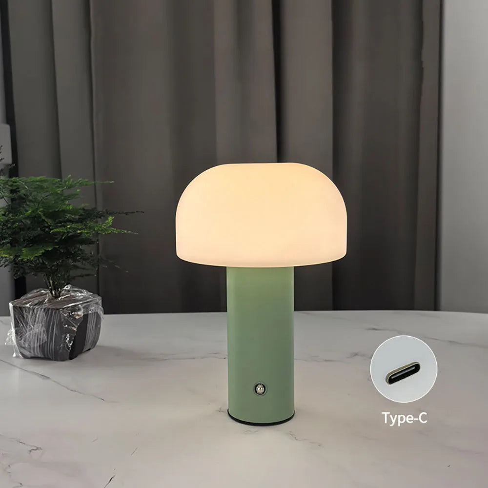 Green mushroom table lamp with a USB-C port on a neutral background