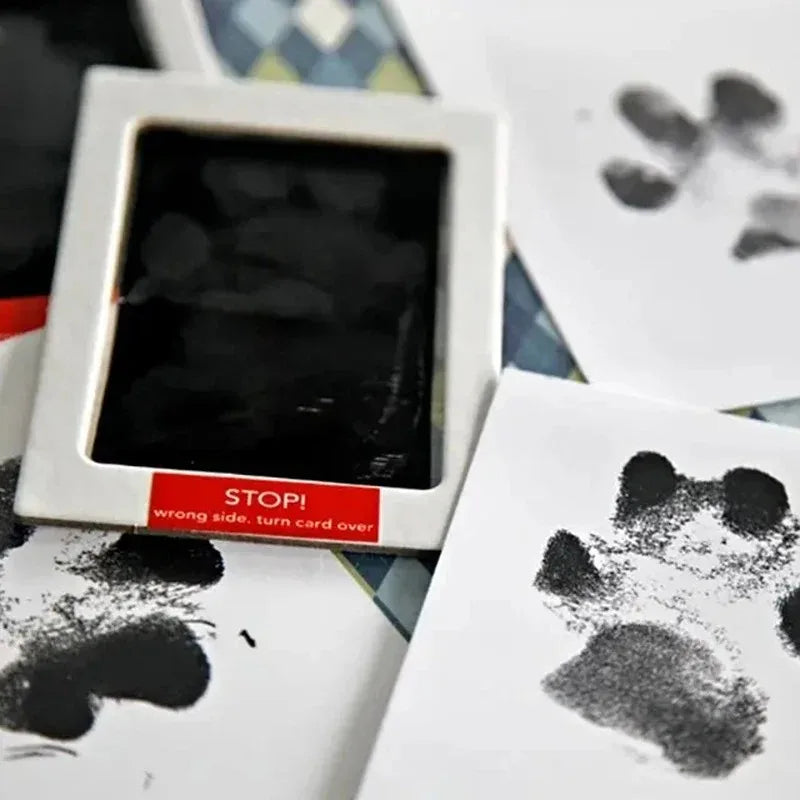 Card with paw prints and a 'STOP!' label on a colorful background