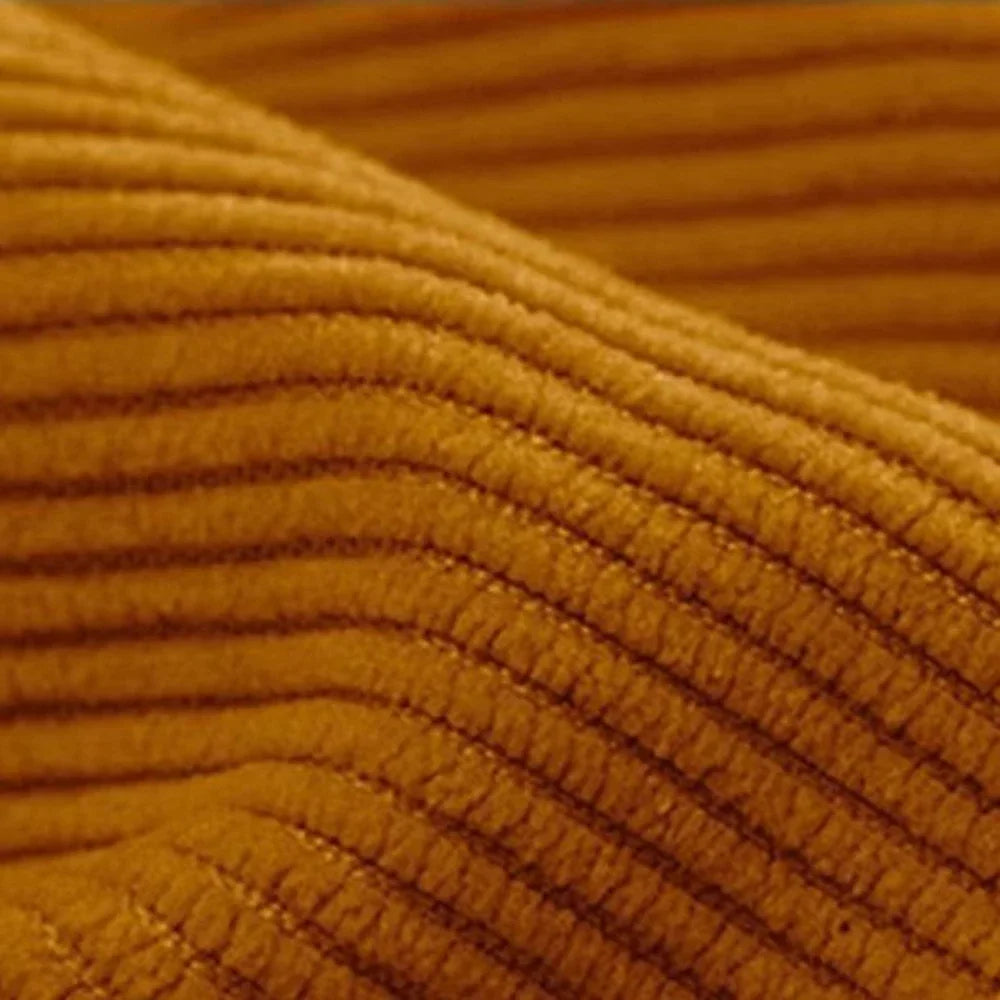 Close-up of textured mustard yellow fabric