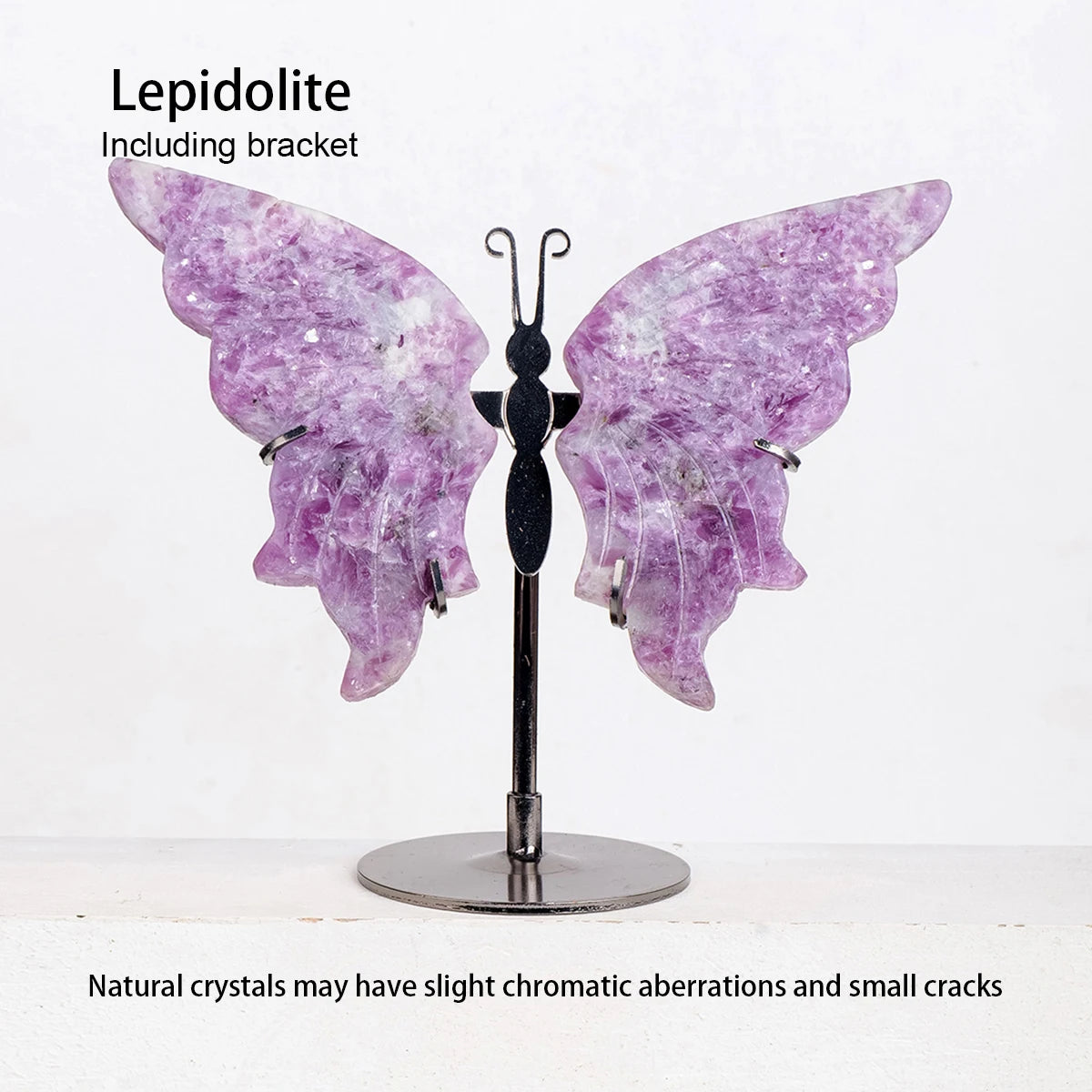Butterfly-shaped lepidolite crystal on a stand with text about natural crystals.
