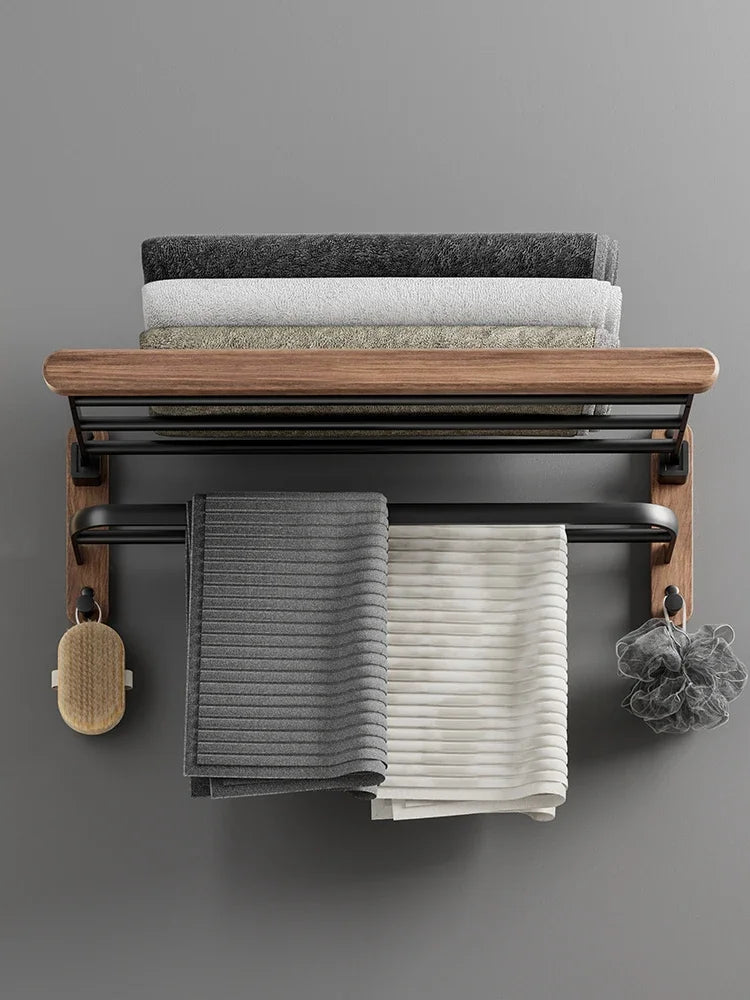 Towel rack with folded towels on a gray wall