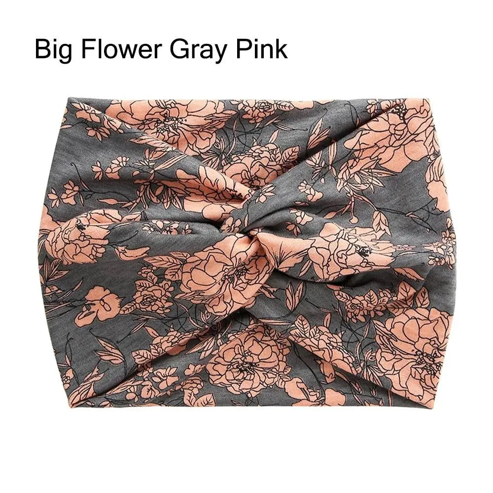 Floral headband with pink flowers on a gray background