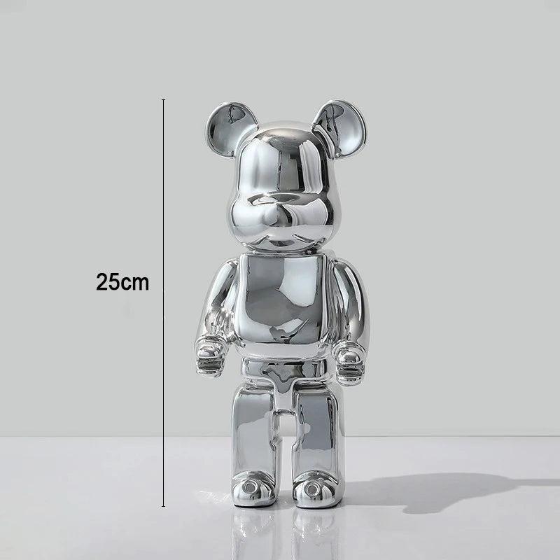 Silver bear-shaped figure with measurement label on a white background