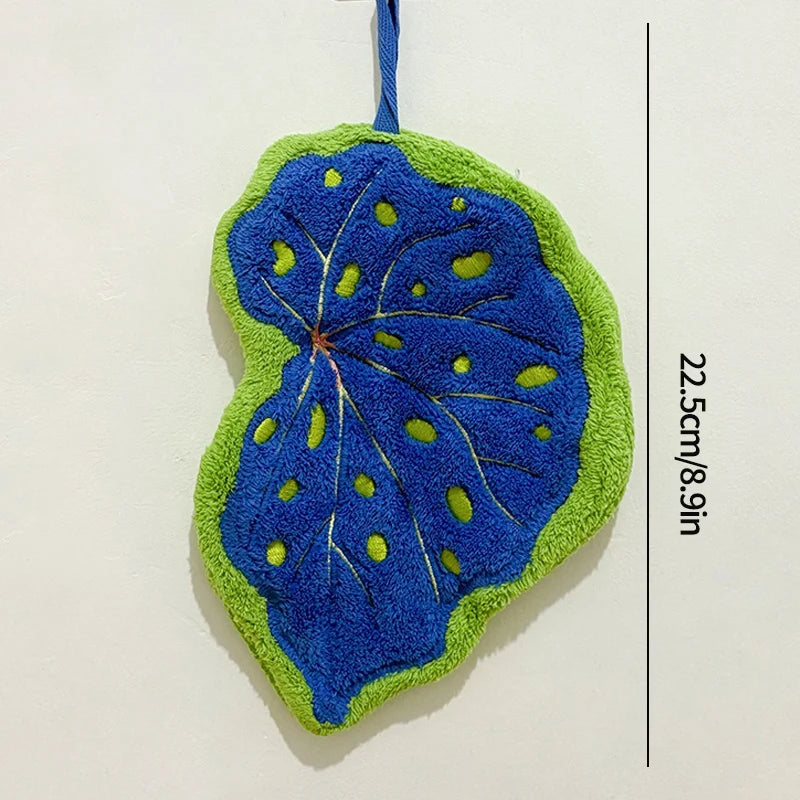 Blue and green leaf-shaped towel on a white background with measurement text.