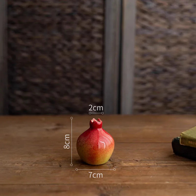 Pomegranate on a wooden surface with measurements indicated