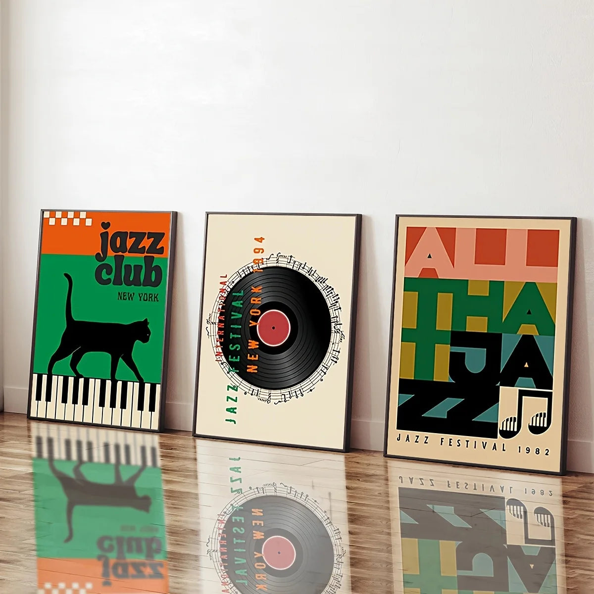Three framed posters with jazz-themed designs on a wooden floor.