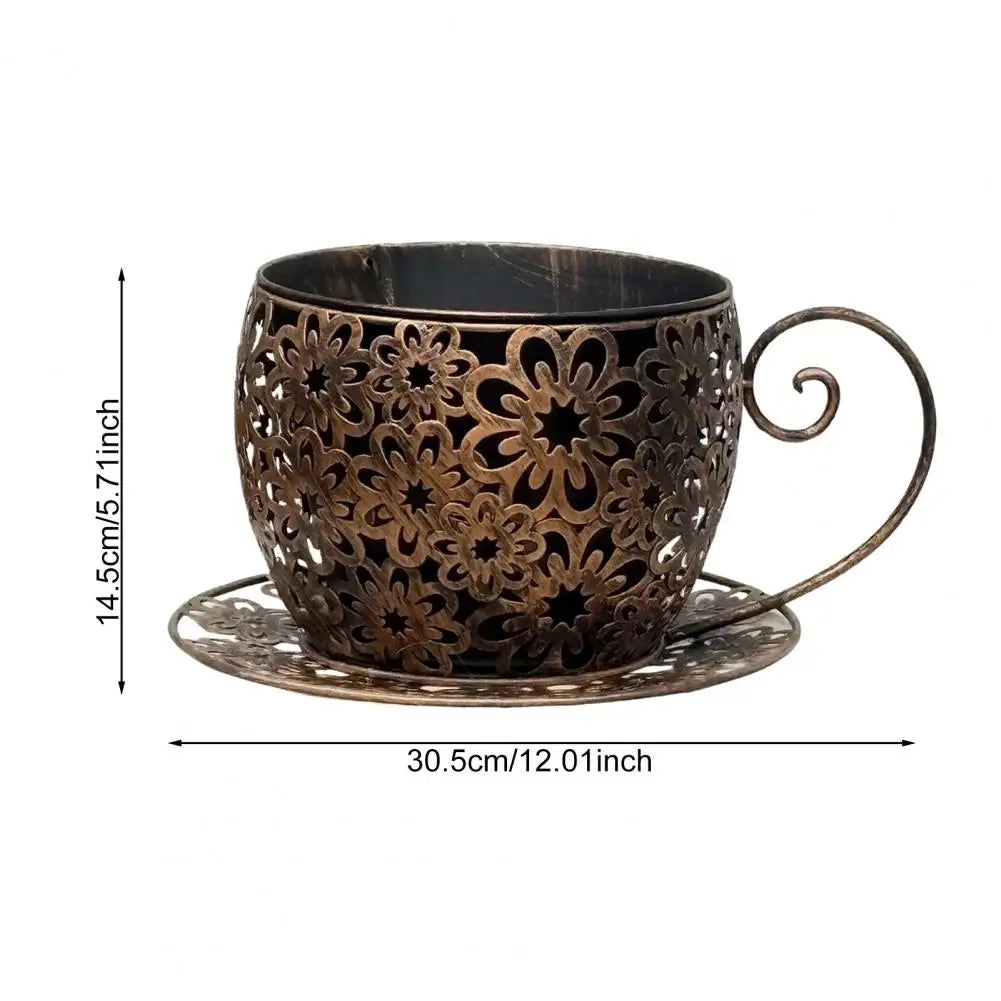 Decorative bronze cup with intricate patterns on a white background