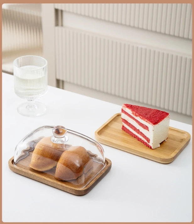 Glass pastry display dome with bamboo serving base