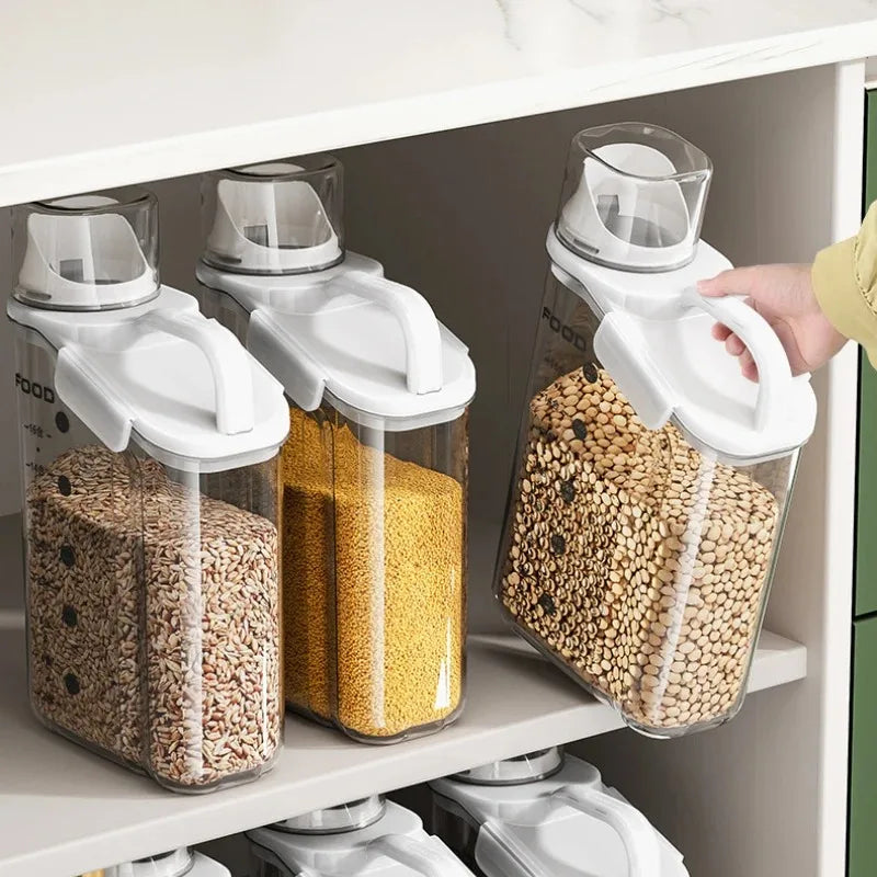 Set of kitchen storage containers with lids on a shelf.