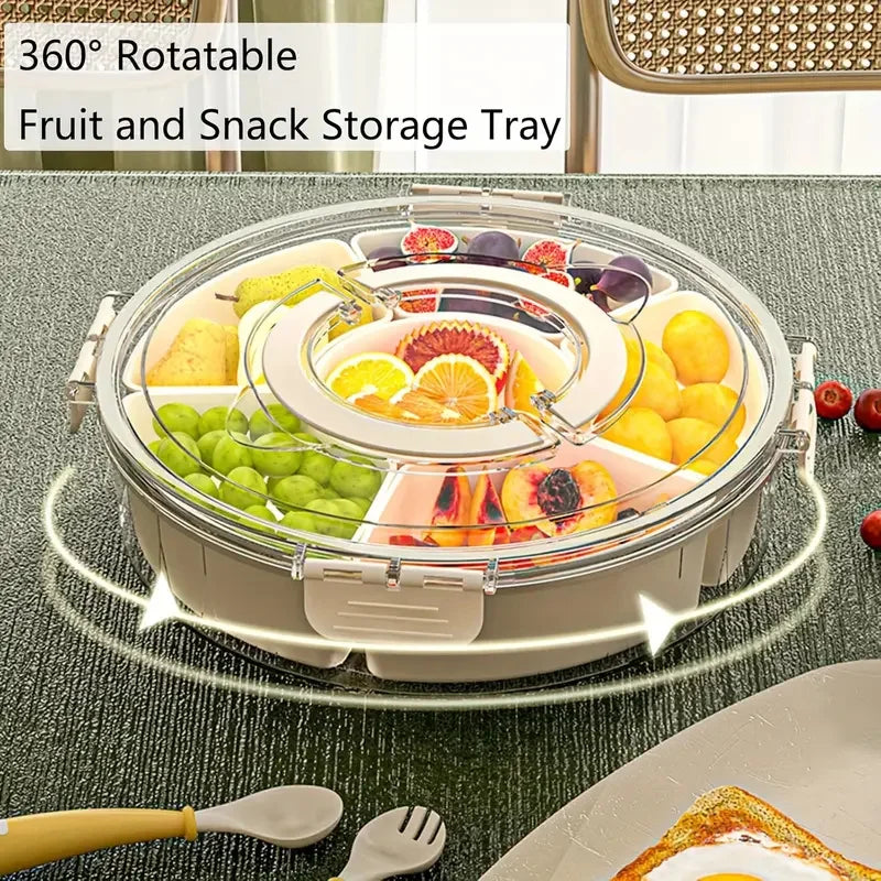 360-degree rotatable fruit and snack storage tray with various fruits on a table.