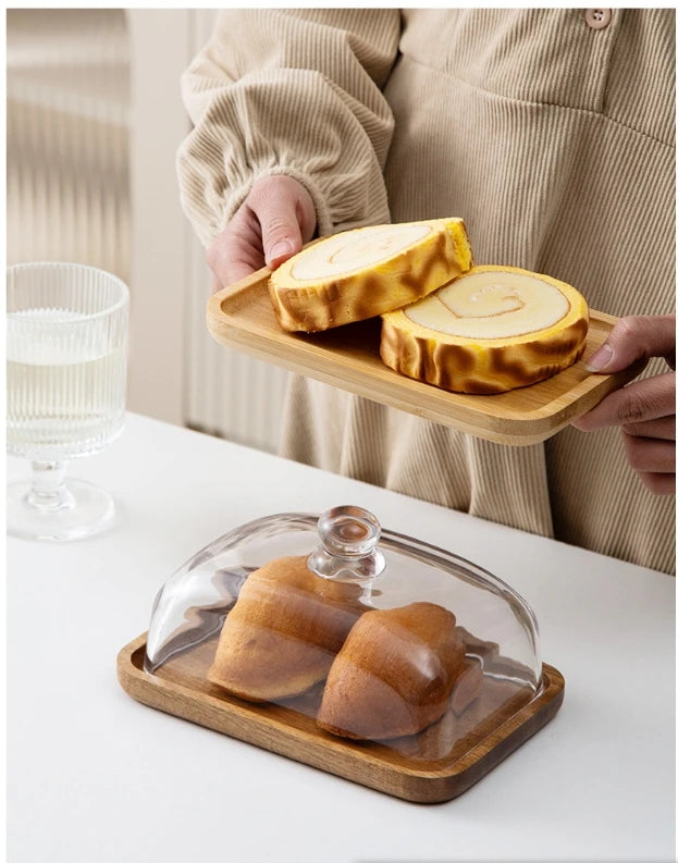 Glass pastry display dome with bamboo serving base