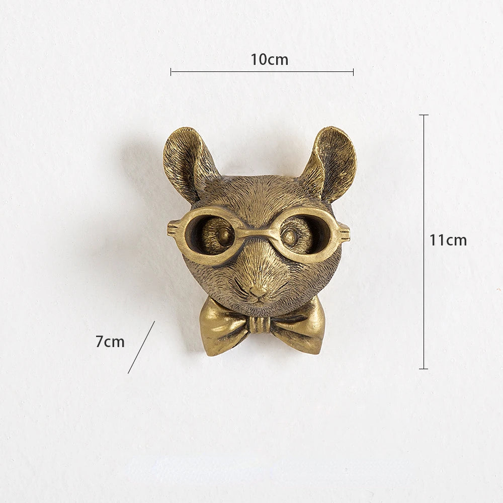 Bronze animal figurine with glasses and a bow tie, shown with measurements on a white background