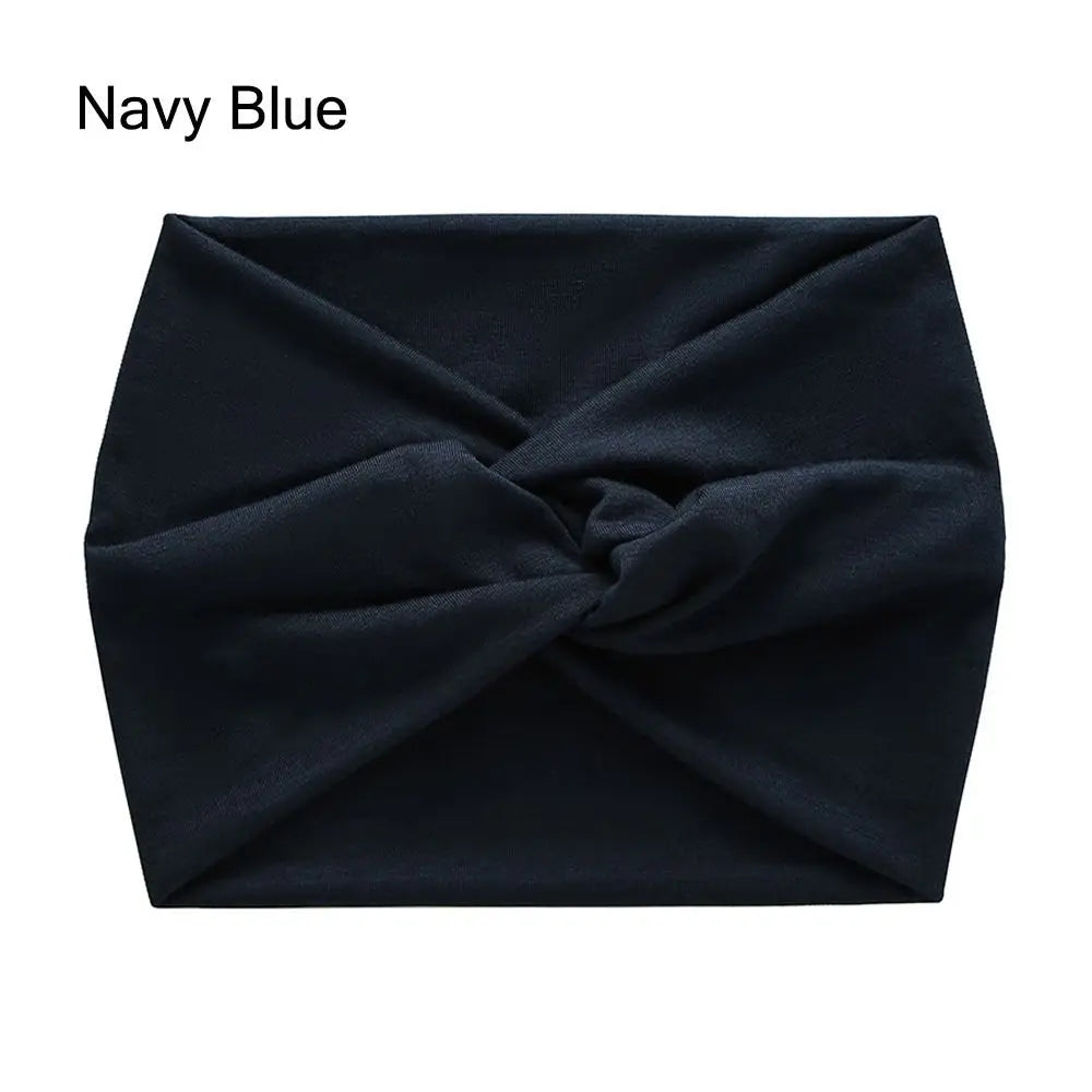Navy blue headband with a knot on a white background
