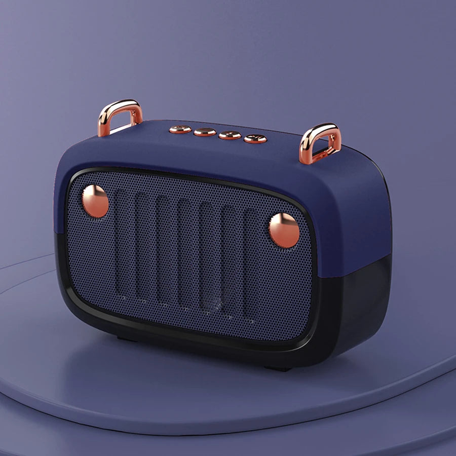 Blue and rose gold portable speaker on a purple background