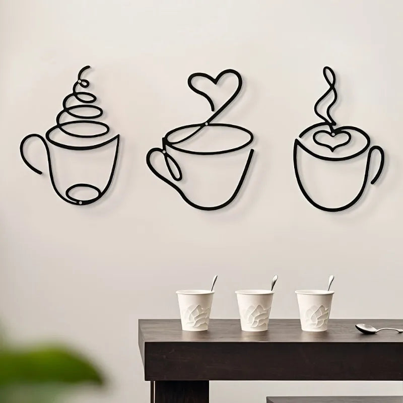 Decorative wall art of coffee cups with steam and hearts on a plain wall.