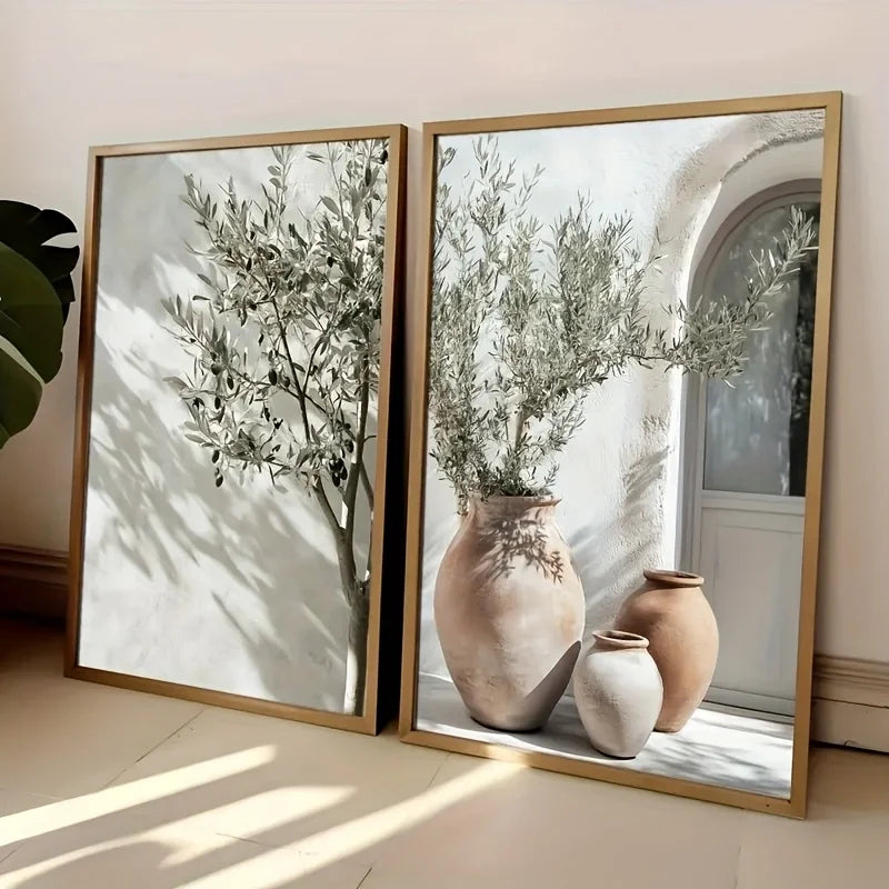 Two framed prints of vases with plants on a light-colored floor.
