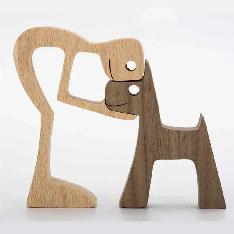 Wooden dog and cat figurines on a white background