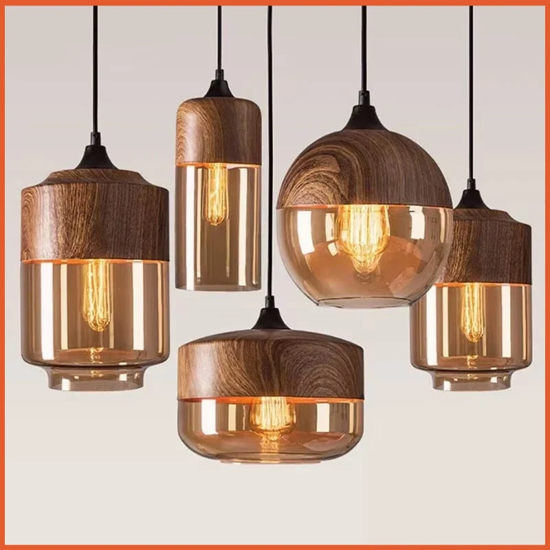 Set of wooden pendant lights with glass shades on a neutral background