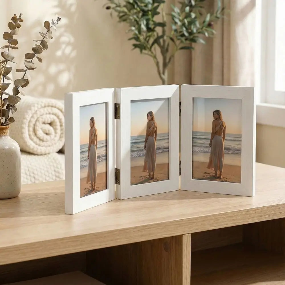 Triple folding wooden photo frame with three hinged panels displayed on a tabletop, perfect for showcasing family photos, travel memories or special occasions in a modern home.