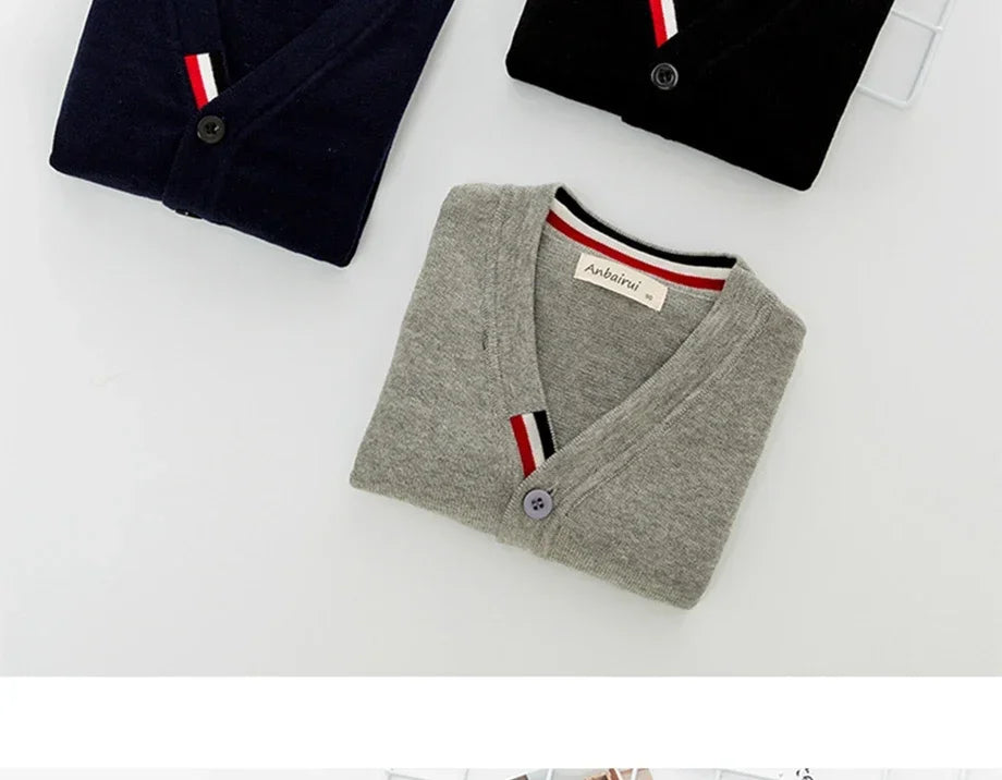 Gray cardigan with brand label on a white background