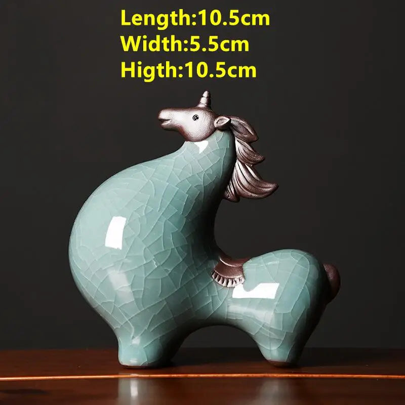 Ceramic unicorn figurine with dimensions on a dark background