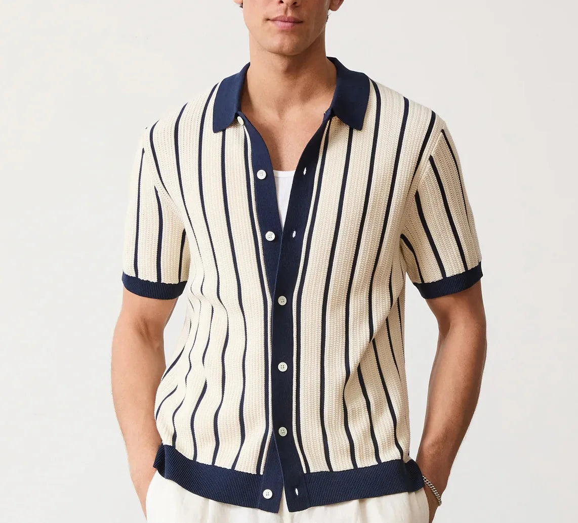 Man wearing a striped shirt with navy accents on a white background