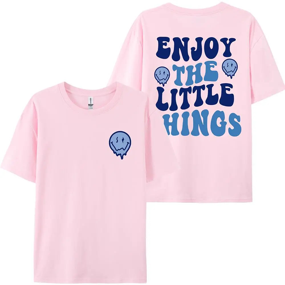 Pink t-shirt with blue text and graphics on a white background