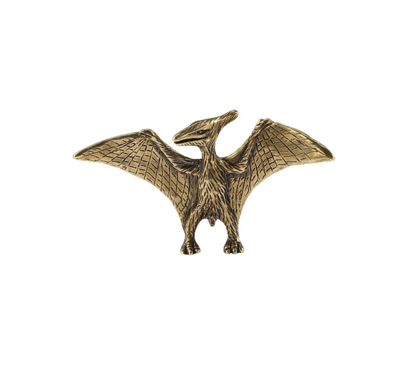 Bronze pterodactyl figurine on a white background