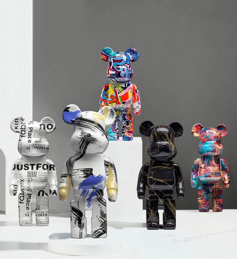 Collection of colorful and stylized bear figurines on a gray background