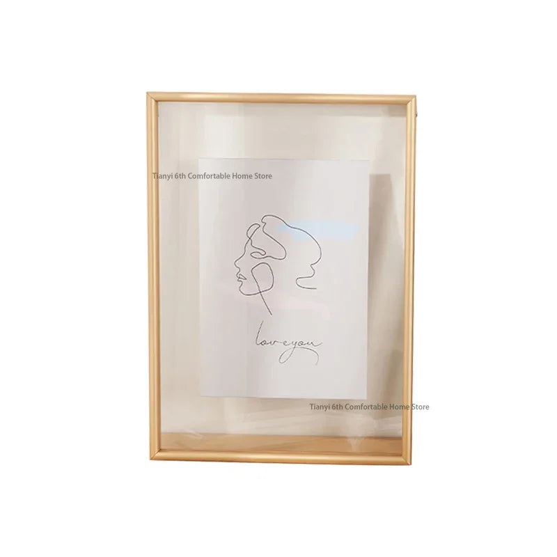 Framed artwork with a minimalist line drawing and 'love you' text on a light background