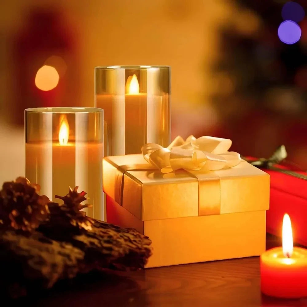 Decorative scene with gold candles and a gift box on a blurred background